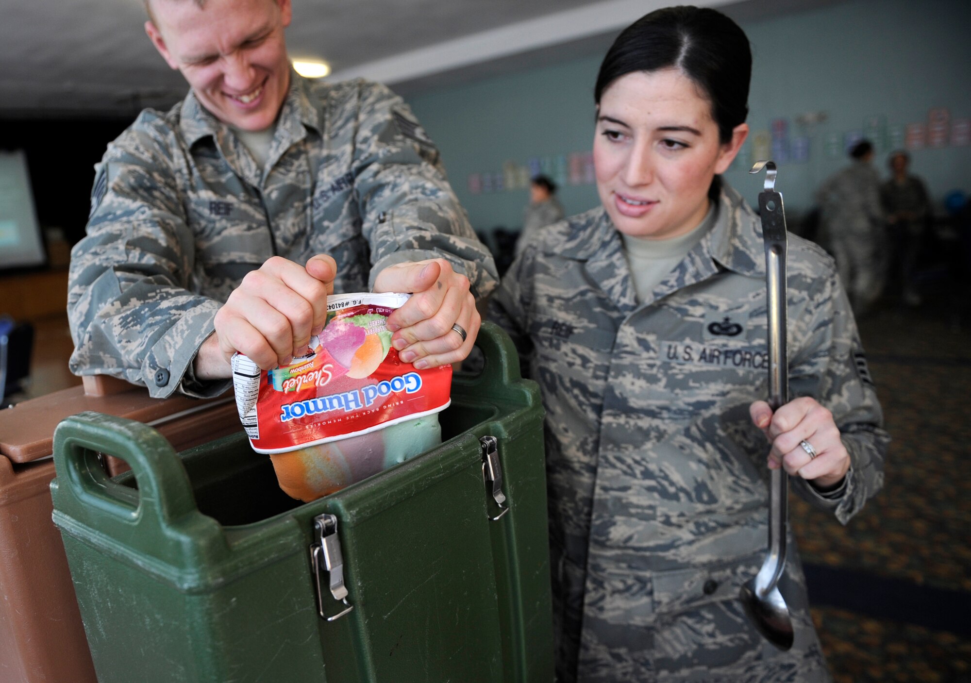 MOUNTAIN HOME AIR FORCE BASE, Idaho -- Staff Sgt. Bill Reif, 366th Fighter Wing Equal Opportunity Office, pours sherbet ice cream into a container before mixing with seven-up to make an iced beverage while Staff Sgt. Jasmine Reif, 366th FW Public Affairs Office, waits to mix it during the Woman’s History Month taste fest March 6 at the Community Center.  The woman's heritage committee hosted the fest in honor of the annual heritage observance.  (U.S. Air Force photo/ Senior Airman Stephany Miller)