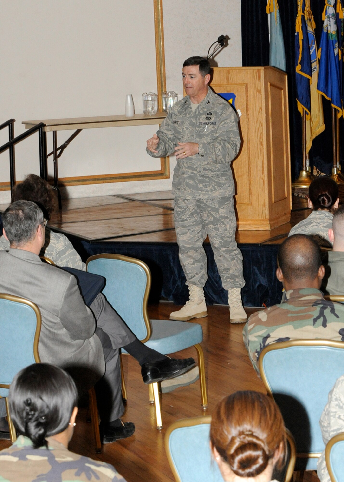 Col. Jim Davis, Air Force Personnel Center Assignments Division chief support officer, speaks during an open participation town hall meeting March 12 at The Club. Colonel Davis and other AFPC experts visited McGuire to pass on information about AFPC and to collect feedback from their customers -- military and DoD personnel. Some of the subjects discussed included assignments, civilian personnel and deployments. The visit was part of the Spread the Word tour, which is geared toward educating Airmen about personnel issues and getting feedback from Airmen about the Air Force's many personnel programs. (U.S. Air Force photo/Wayne Russell)