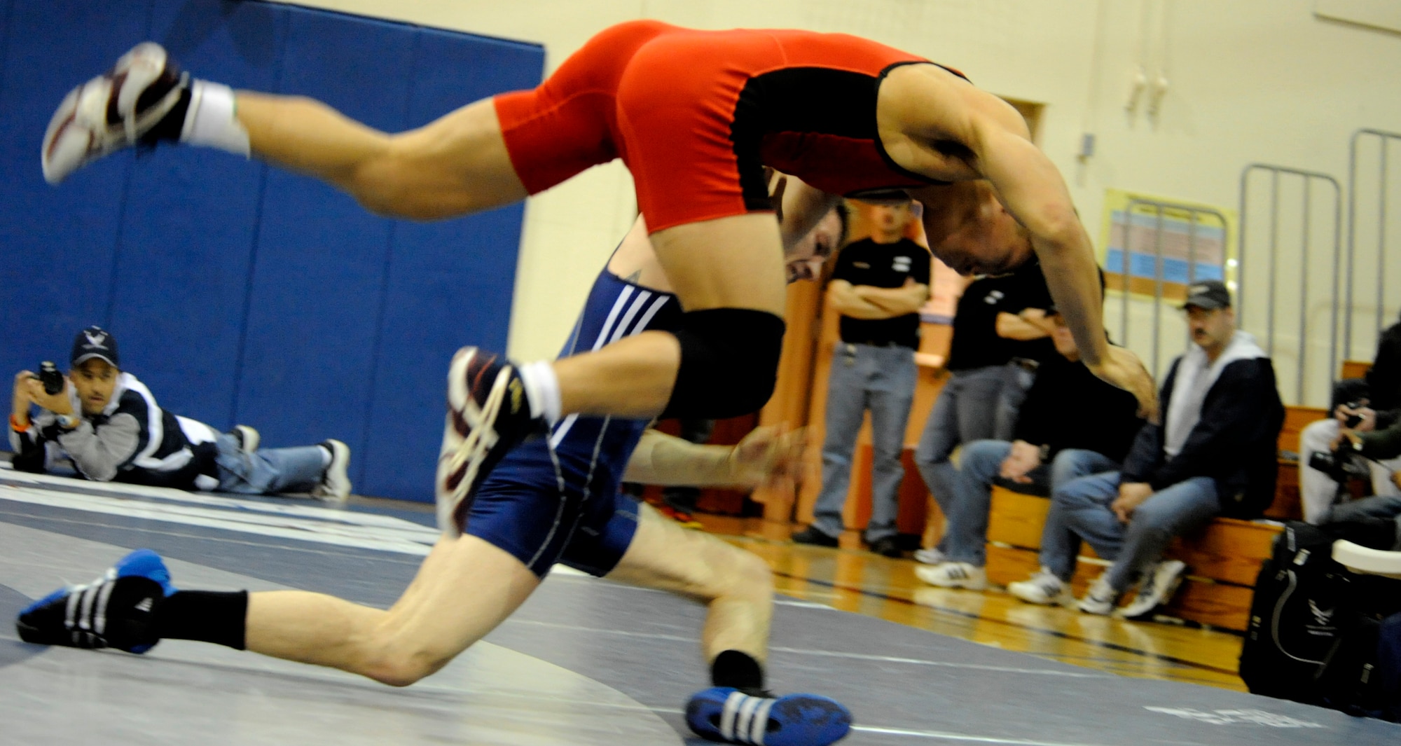 MOUNTAIN HOME AIR FORCE BASE, Idaho -- A member of the Air Force wrestling team wrestles a member of the Navy wrestling team  at the 2009 Armed Forces Wrestling Championships March 15 at Mountain Home Air Force Base. At the two-day Armed forces event that brought together all the best wrestlers across Department of Defense, the Army dominated the mats to win 12 of 14 gold medals. (U.S. Air Force photo/ Senior Airman Stephany Miller)