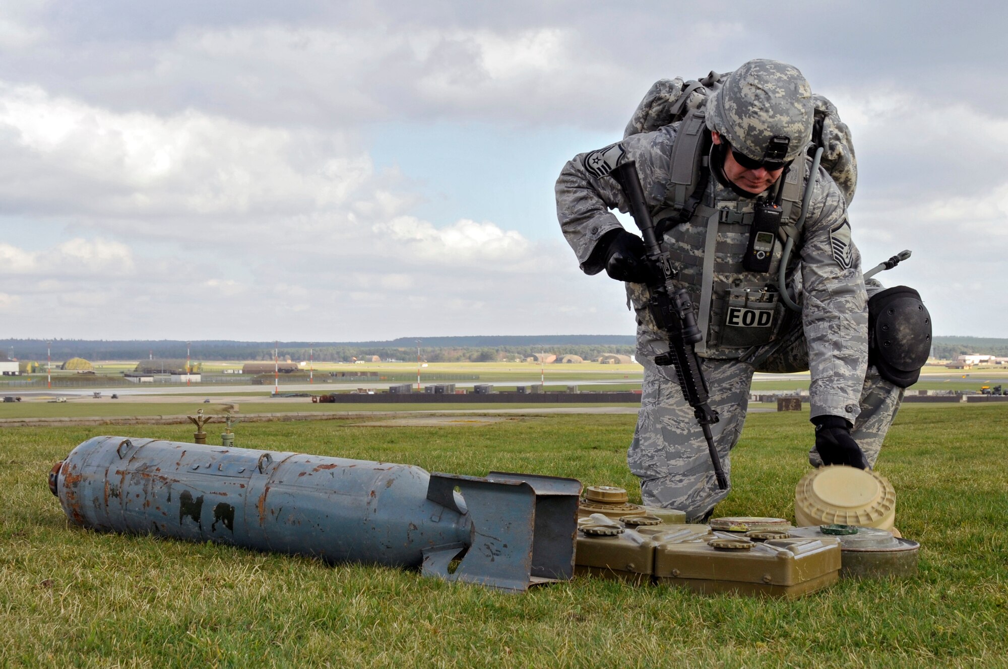 Master Sgt. Kieran Flynn, 48th Civil Engineer Squadron explosive ordnance disposal team member, sets down an inert mine March 6, 2009 at RAF Lakenheath, England. EOD Airmen will arrange the weapons so they will successfully be disposed off. (U.S. Air Force photo by Airman 1st Class Perry Aston)