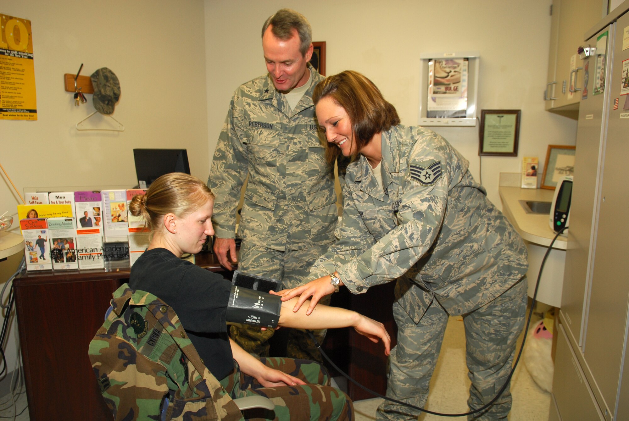 Staff Sgt. Allison Bir, 325th Medical Operations Squadron preventative health assessment program director, administers a blood pressure cuff on Airman 1st Class Tiffany Cypher, 325th MDOS medical technician, while showing Brig. Gen. Darryl Roberson, 325th Fighter Wing commander, her daily duties. Sergeant Bir, selected for the Commander’s Shadow Program, is responsible for delivering medical/preventative healthcare for the wing’s training mission. “Staff Sgt. Bir is truly the crème de la crème of the Air Force,” said Tech. Sgt. Lisa Gamble, Sergeant Bir’s supervisor and nominator. Serving in the Air Force for more than eight years, Sergeant Bir hails from Huntington, Ind. (U.S. Air Force photo by Lisa Norman)