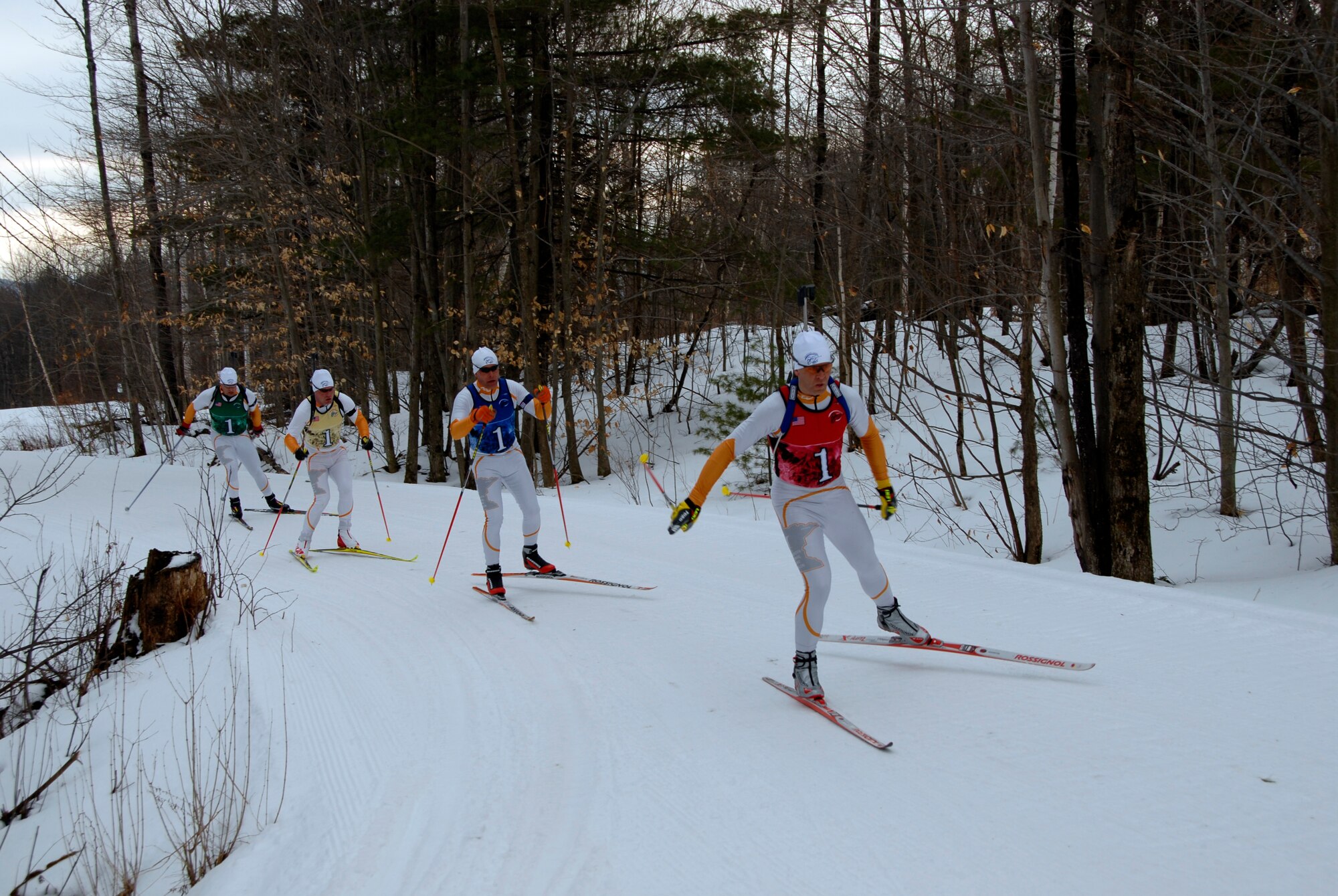 The Minnesota National Guard patrol team races through the woods during the 2009 Chief National Guard Bureau Biathlon Championships at Ethan Allen Firing Range in Jericho, Vt., from March 1-7, 2009.  Minn. finished First Place in the 15 kilometer Patrol Race.   (US Air Force Photo by Lt. Col. Eric Chandler, MN National Guard.)