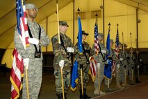 HANSCOM AIR FORCE BASE, Mass. – Honor Guard members from across the New England region stand in formation during a color guard drill led by the U.S. Air Force Honor Guard Mobile Training Team on March 5 at the Tennis Bubble. The USAF Honor Guard team trained Honor Guard members, both active duty and reserve from around the New England area from March 2 to 11. (U.S. Air Force photo by Linda LaBonte Britt) 