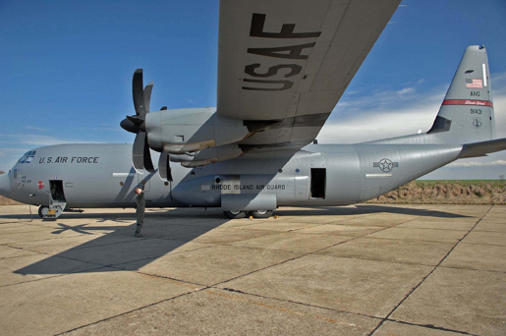 Rhode Island Air National Guard Master Sgt. Kyle Gurnon, loadmaster, performs a pre-flight inspection of a C-130J Super Hercules during Operation Thracian Spring, Bezmer Air Base, Bulgaria, March 9, 2009. The aircraft, belonging to the RIANG, is being used for training and air crew qualifications during the exercise. Operation Thracian Spring is a two week exercise allowing U.S. forces an opportunity to train and interact with their Bulgarian counterparts. (U.S. Air Force photo by Airman 1st Class Tony R. Ritter)