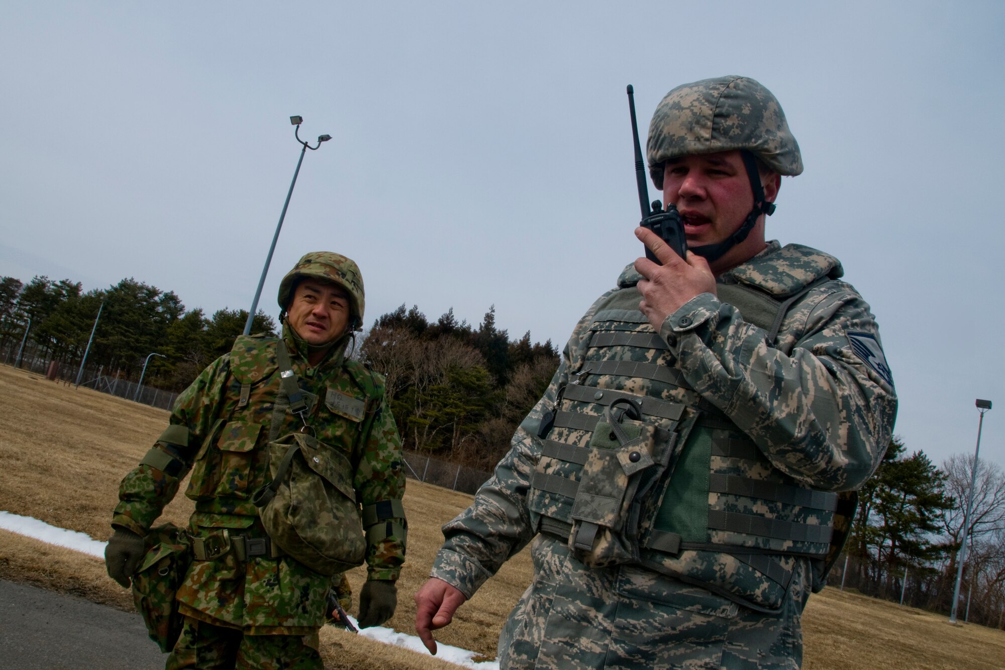 MISAWA AIR BASE, Japan -- Master Sgt. Robert Loughmiller, 35th Security Forces Squadron, relays a message during an Exercise Guard and Protect scenario March, 13, 2009. The exercise marked the first time the Japanese and American forces included 24-hour operations and manned a combined base defense operations center. (U.S. Air Force photo by Senior Airman Jamal D. Sutter)
