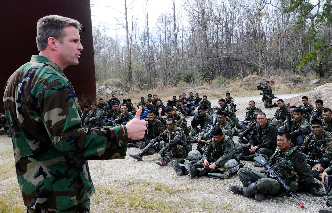 U.S. Navy Cmdr. Bill Mahoney, commanding officer of Naval Small Craft Instruction and Technical Training School, speaks to Naval Small Craft Instruction and Technical Training School and Western Hemisphere Institute for Security Cooperation students about the success of the joint field training exercise they just completed at Stennis Space Center, Miss., March 6, 2009.