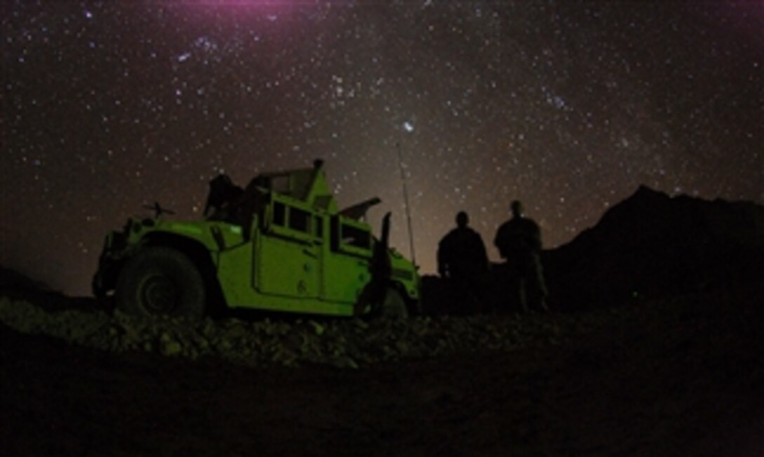 U.S. Army Spc. Stephen Highberger and Pvt. Charles Joiner, both from Bravo Company, 1st Battalion, 4th Infantry Regiment, U.S. Army Europe, man a patrol base during an overnight mission near Forward Operating Base Lane in the Zabul province of Afghanistan on March 13, 2009.  