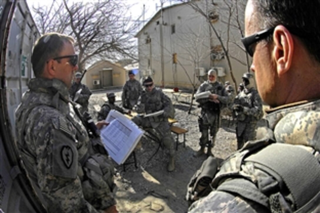 U.S. Army Sgt. Bradley Yingling briefs airmen and soldiers prior to a convoy mission to Mahmood Raqi, Afghanistan, March 14, 2009. More than a dozen Provincial Reconstruction Team members took part in the mission to visit several coalition-sponsored construction projects and met with elected members of the Kapisa Provincial Development Council to discuss security matters and community concerns.