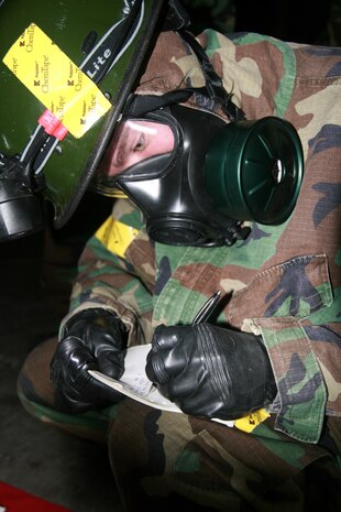 Pfc. Josh Stanley, identification and detection specialist, identification and detection platoon (IDP), Headquarters and Service Company, Chemical Biological Incident Response Force, II Marine Expeditionary Force, documents a sample he tested in a simulated contaminated environment at Eastern Shield, an exercise here March 17th. After extracting the samples from the contaminated area, the samples went to CBIRF’s mobile laboratory; where Marines can test what type of contaminant their sample is.