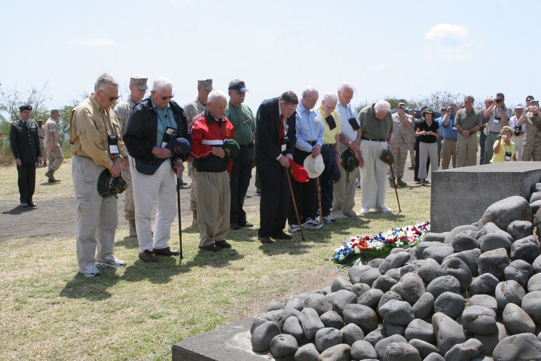 U.S. Marine Corps veterans of the battle of Iwo Jima pause for a moment of silence in front of the Reunion of Honor Memorial March 18 during the 64th Anniversary Commemoration Ceremony of the battle of Iwo Jima.