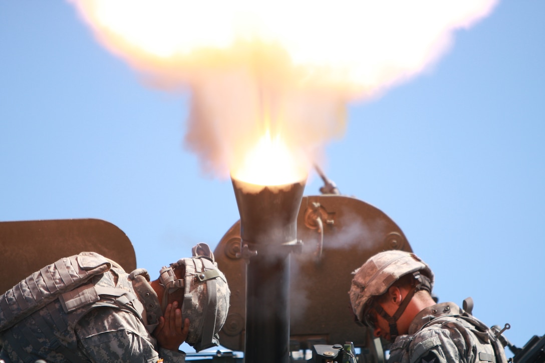 Infantrymen with Company C, 1st Battalion, 23rd Infantry Regiment, fire off their 120mm mortar during the final exercise of the battalion’s coop training with Company C, 1st Tank Battalion.