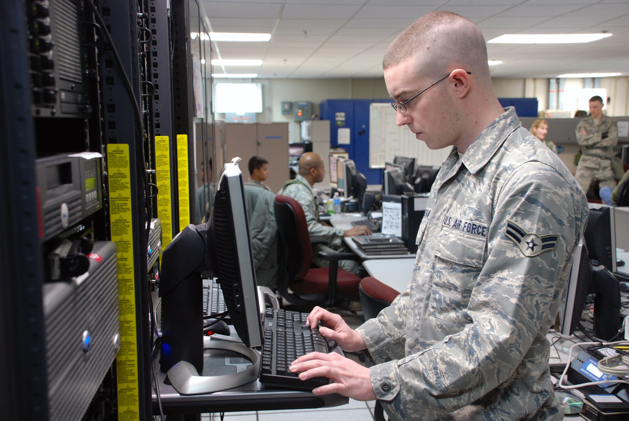 Airman 1st Class Patrick Donovan, 607th Air Communications Squadron command and control systems administrator, checks the configuration of a server in the Korean Combat Operations Intelligence Center during Exercise Key Resolve/Foal Eagle March 18.  The 607 ACOMS is responsible for fielding new and ensuring current communications are available to allow the supporting weapon system divisions to provide their products to Combat Operations to execute the Air Tasking Order. (USAF photo by Staff Sgt. Alex Saltekoff)