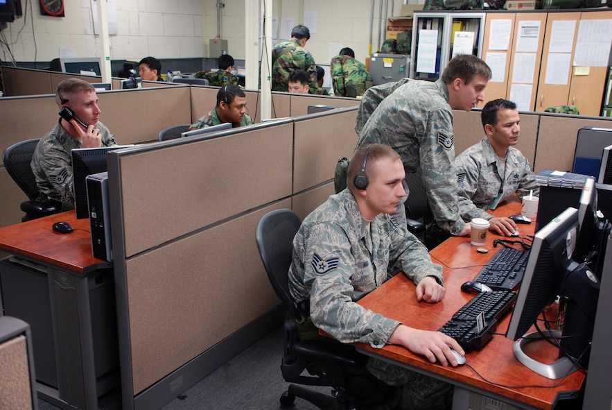 Members of the 607th Air & Space Communications Squadron help desk work to keep the computer systems running March 18 in the Hardened Tactical Air Control Center during Exercise Key Resolve/Foal Eagle. The 607 ACOMS is responsible for fielding new and ensuring current communications are available to allow the supporting weapon system divisions to provide their products to Combat Operations to execute the Air Tasking Order.