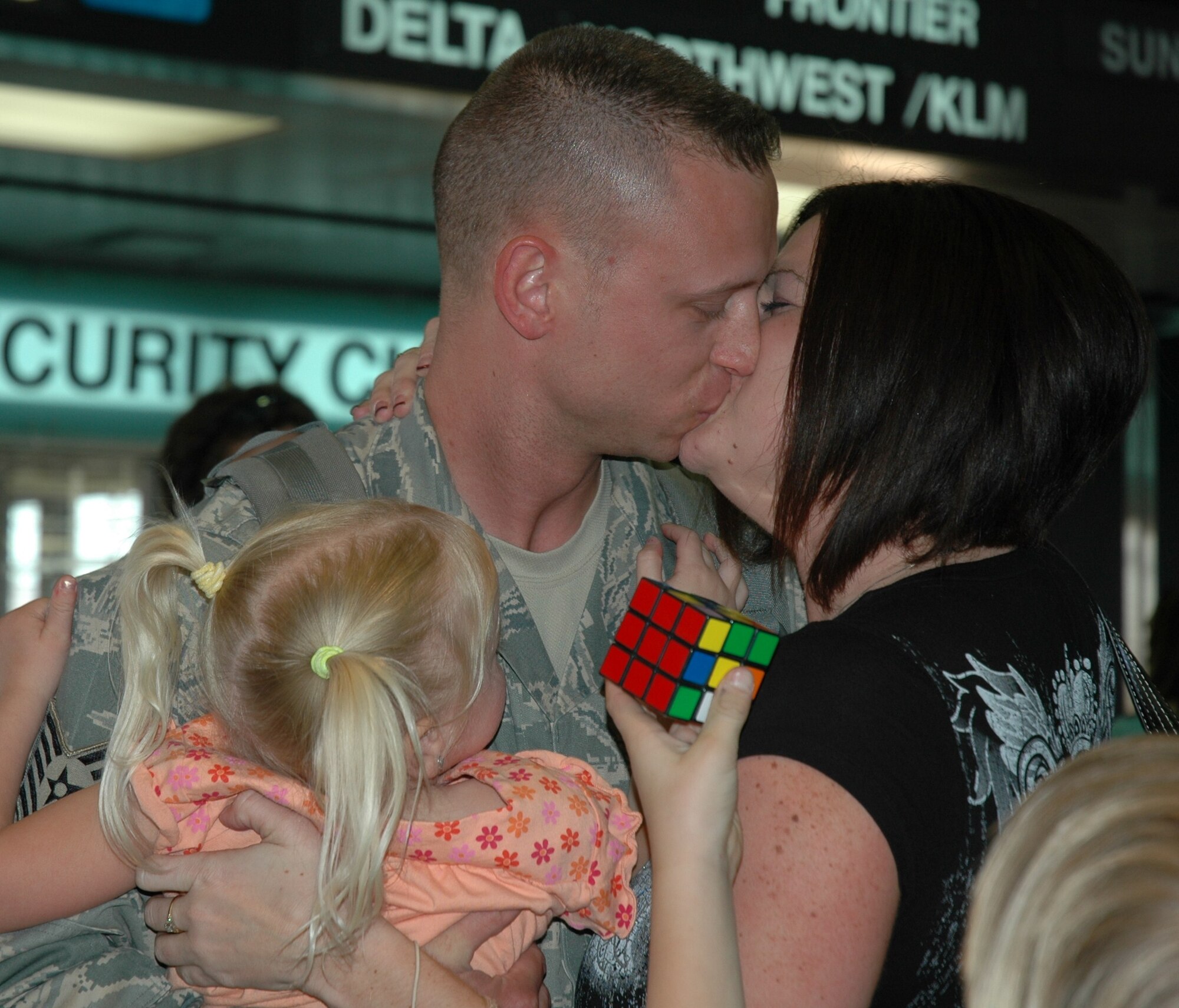 Tech. Sgt. Eric Grubbs, 944th Civil Engineer Squadron member, is greeted by his family March 17 at Phoenix Sky Harbor International Airport after returning from a deployment at Kirkuk Regional Air Base, Iraq. Sergeant Grubbs, along with 23 other reservists from the 944th CES, spent six months away from their families and civilian jobs in support of the Global War on Terrorism. (U.S. Air Force photo/Tech. Sgt. Susan Stout)
