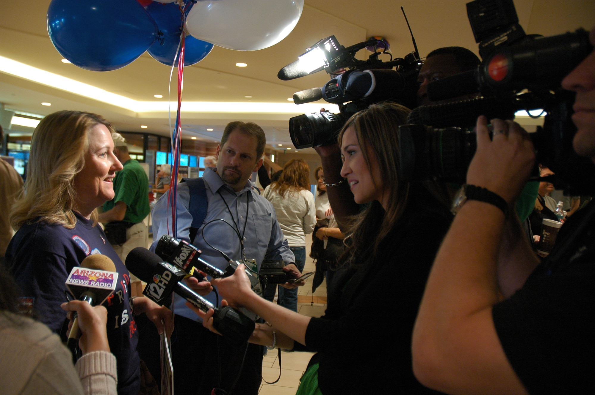 Kelly Dourlein is interviewed March 17 at Phoenix Sky Harbor International Airport while waiting for her husband to return from a deployment at Kirkuk Regional Air Base, Iraq. Her husband, Senior Master Sgt. Jan Dourlein, along with 23 other reservists from the 944th Civil Engineer Squadron, spent six months away from their families and civilian jobs in support of the Global War on Terrorism. (U.S. Air Force photo/Tech. Sgt. Susan Stout)