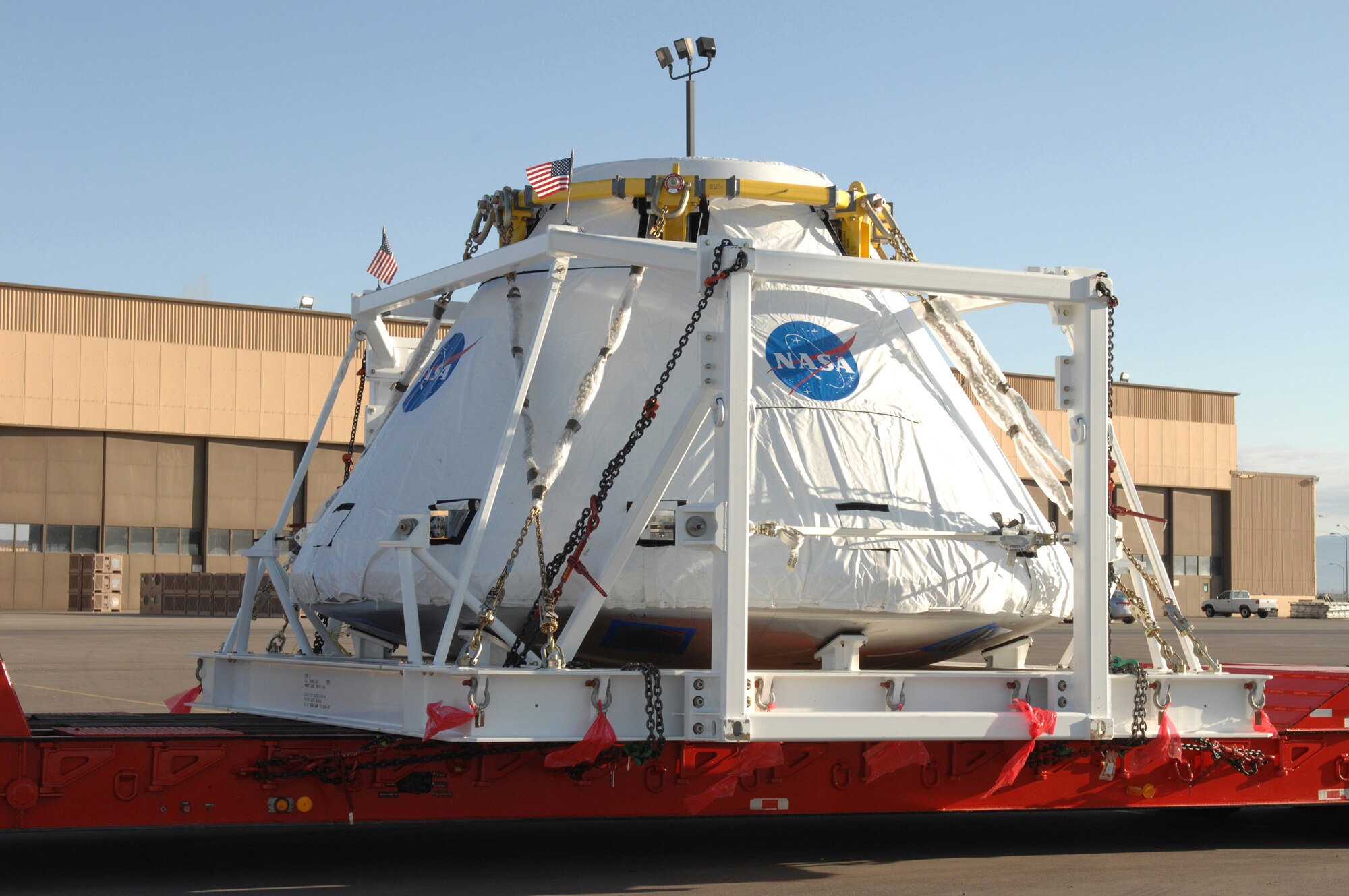 A NASA crew module unit sits on a transport trailer at Holloman Air Force Base, N.M., on March 13, 2009. The pathfinder unit, used for ground handling and ground ops training, was delieverd here for a test at White Sands Missile Range. (U.S. Air Force photo/Senior Airman Russell Scalf)