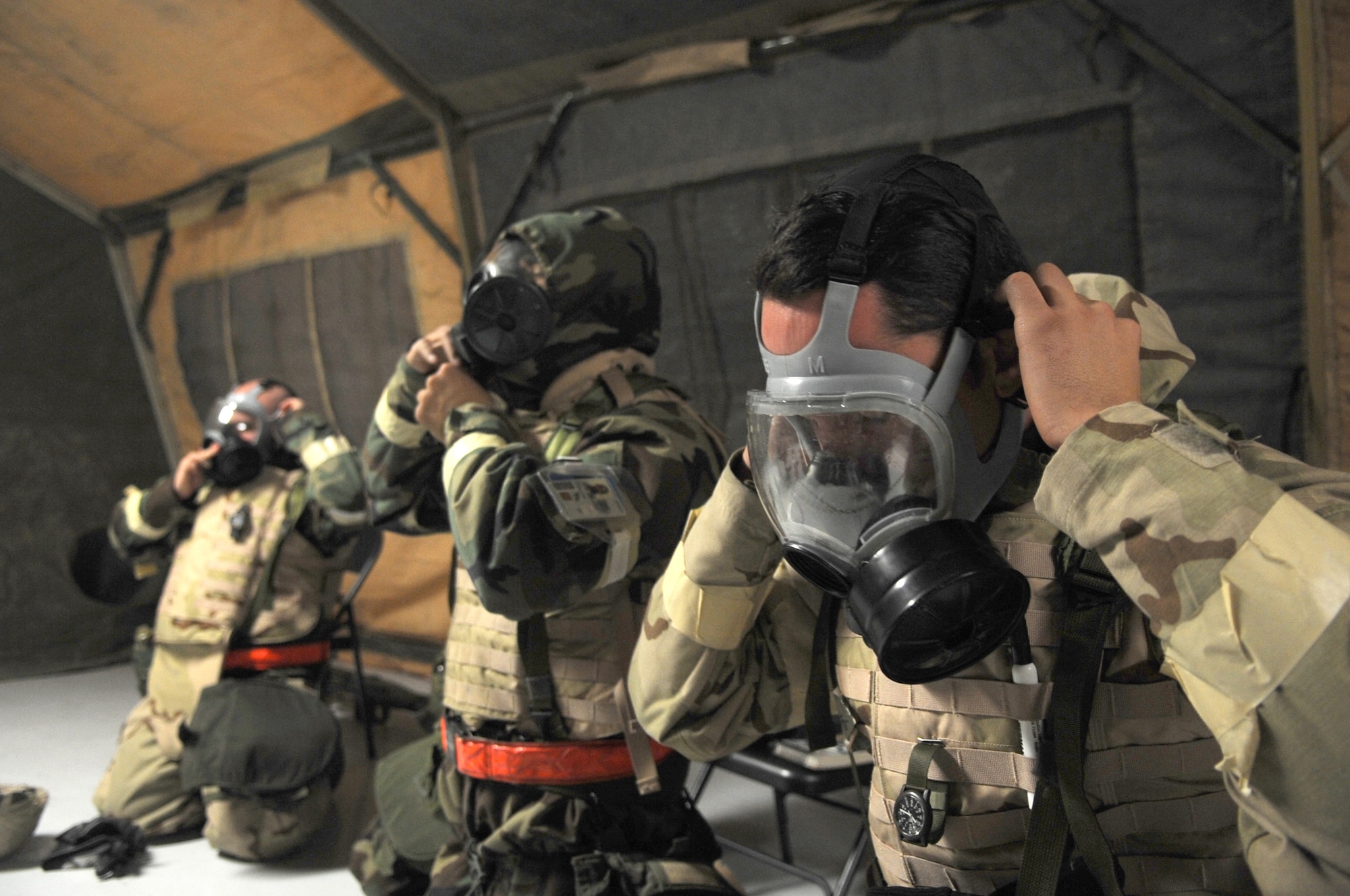 Members of the 319th Maintenance Squadron quickly don protective masks during one of many training scenarios given by the exercise evaluation team members.
(Photo/Staff Sgt. Suellyn F. Nuckolls)