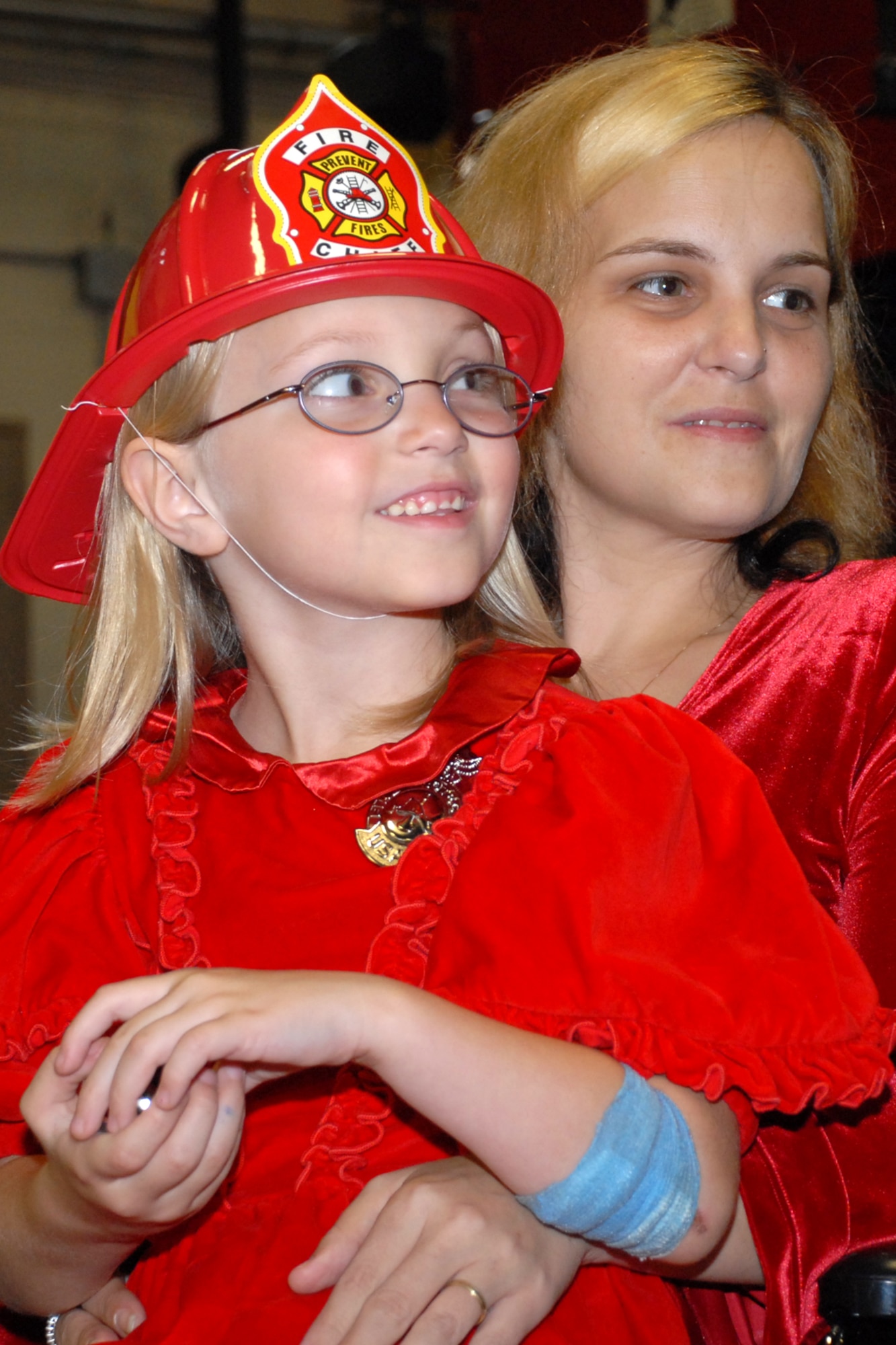 EGLIN AIR FORCE BASE, Fla. -- Victoria Kroll, a 6-year-old child who called 9-1-1 when her mom fell in the bathroom, picks the fire truck she wants to take a ride in during a ceremony at Station 1 March 16. The Eglin Fire Department and the 96th Civil Engineer Group honored Victoria, daughter of Tech. Sgt. Shawn Kroll, 1st Special Operations Maintenance Squadron, and Angie, as the youngest and newest member of the team for her bravery made her an honorary firefighter. (U.S. Air Force photo by Staff Sgt. Mike Meares)