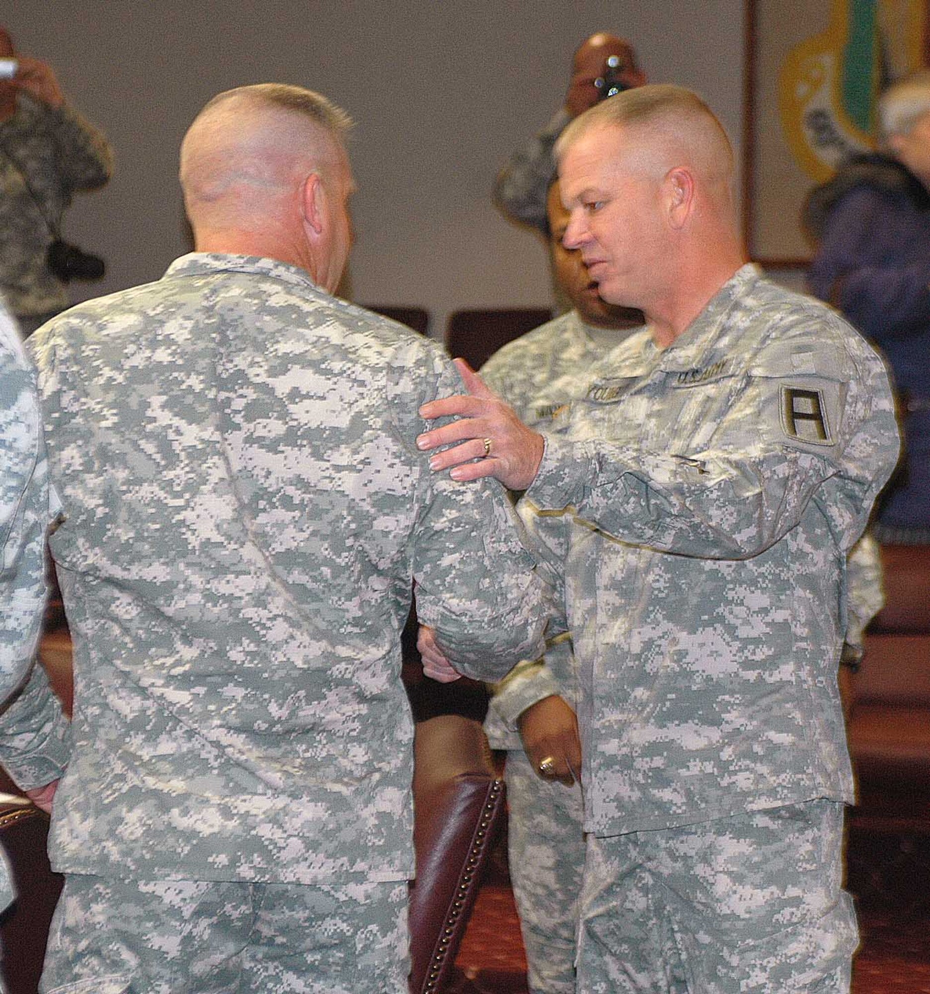 Command Sgt. Maj. Terry Young, Division West CSM, greets members of the 402nd Field Artillery Brigade during his visit to Travis March 16. Travis was one of several stops the command sergeant major made to different Army installations in California. (U.S. Air Force photo/Senior Airman Kristen Rohrer)