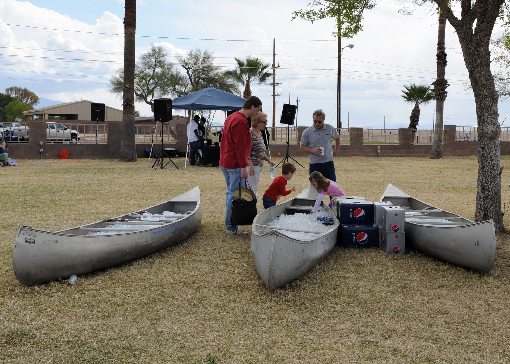 A family grabs ice-cold drinks from a canoe during the 16th annual D-M 50 picnic at Bama Park March 13. The D-M 50 hosts the picnic for D-M personnel and their families with free entertainment and food. (U.S. Air Force photo/Airman 1st Class Brittany Dowdle)
