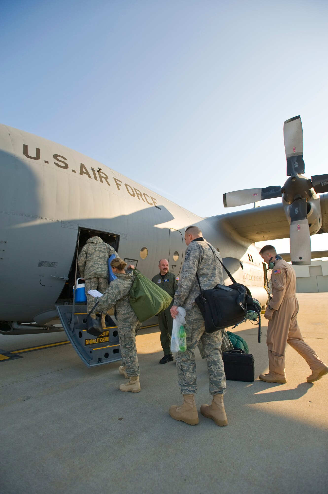 Kentucky Air Guardsmen board a C-130 en route to Afghanistan on March 18. The Louisville, Ky.-based Airmen will be providing airlift services as part of Operation Enduring Freedom through May 19. (USAF photo by Capt. Dale Greer)