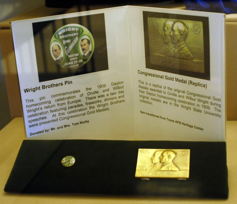 The Wright Brothers Pin and replica Congressional Gold Medal honored Orville and Wilbur Wright during their 1909 Dayton homecoming celebration. (U.S. Air Force photo)