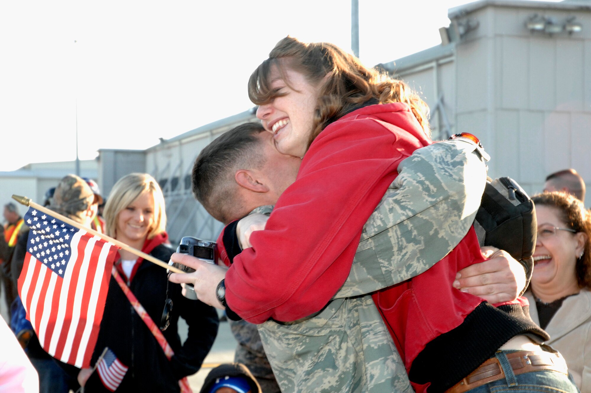 WRIGHT-PATTERSON AFB, Ohio – Staff Sgt. James Epley, 445th Civil Engineer Squadron, is greeted by family and friends after returning from a six month deployment to Southwest Asia.  A group of 60 Civil Engineer Airmen returned to the base Sunday, March 15. (Air Force photo/Al Bright)   