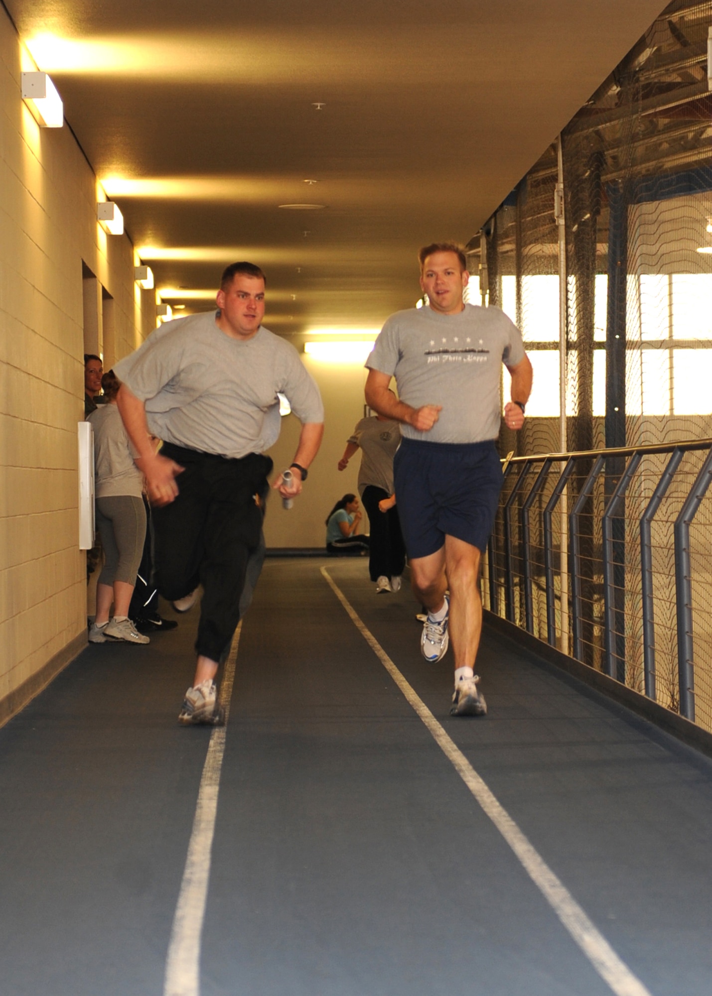 2nd Lt. Clair Corbin and Tech. Sgt. Carl Balser, 846 Test Group, compete in a four person relay, during a Biggest Loser event, Mar. 13, at the Fitness and Sports Center at Holloman Air Force Base, N.M. This is a continuous challenge for the participants, which occurs biweekly. (U.S. Air Force photo/Airman 1st Class Rachel Kocin)