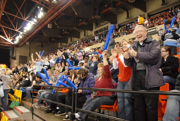 ANCHORAGE, Alaska -- Members of the 477th Fighter Group cheer after an Aces  goal during the Alaska Aces hockey game March 14.  The Alaska Aces sponsored a night full of 477 FG events.  They displayed videos and photos on the Aces jumbo screen and gave free tickets to 477 FG Reservists.  The 477th Fighter Group is Air Force Reserve Command's first F-22A Raptor unit and the first Reserve flying unit based in the Pacific theater of operations. (U.S. Air Force Photo by Tech. Sgt. Rhiannon Willard)