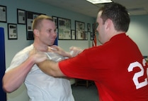 Master Sgt. Jeff Rose (left), 919th Civil Engineer Squadron, practices breaking a choke hold during a Krav Maga training class taught weekly at Duke Field. Krav Maga is a type of close-quarters combat training developed in Israel and used by Israeli Defense Forces as well as several U.S. government and law enforcement agencies. Rigorous training routines help students build greater cardio fitness, muscle strength and coordination, as well as provide strong self defense tactics for real world or combat situations.  (U.S. Air Force photo / Master Sgt. Paul Morales)