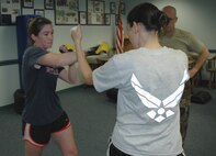 Senior Airman Kristina Andreozzi (left), 919th Maintenance Group, and Tech Sgt. Kay Kendall (right), 919th Security Forces Squadron, practice striking and blocking techniques learned in a Krav Maga class taught weekly at Duke Field. Krav Maga is a type of close-quarters combat training developed in Israel and used by Israeli Defense Forces as well as several U.S. government and law enforcement agencies. Rigorous training routines help students build greater cardio fitness, muscle strength and coordination, as well as provide strong self defense tactics for real world or combat situations. (U.S. Air Force photo / Senior Airman Jon McCallum)