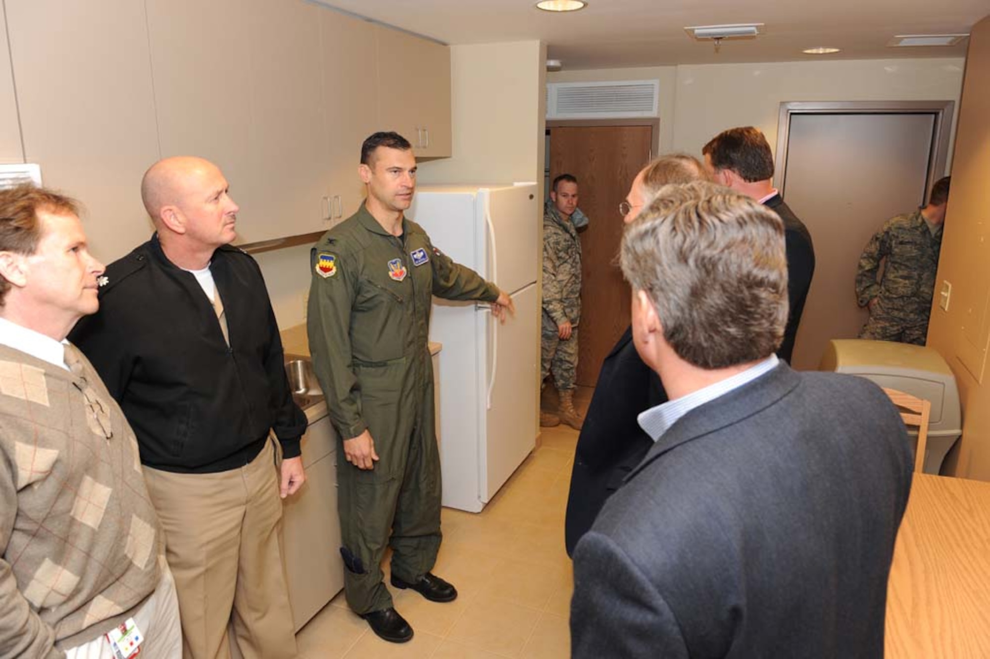 SHAW AIR FORCE BASE, S.C. -- Col. Joseph Guastella, 20th Fighter Wing commander, provides a tour of Shaw's new dormitory to the Sumter Mayor, Joseph McElveen and other distinguished visitors March 13. The suites in the new dorm consist of a common area with a full kitchen, living room, laundry room and four private bedrooms. Each bedroom is equipped with a private bathroom and a walk-in closet. The new dormitory has space for 144 occupants. (U.S. Air Force photo/Senior Airman Matthew Davis)