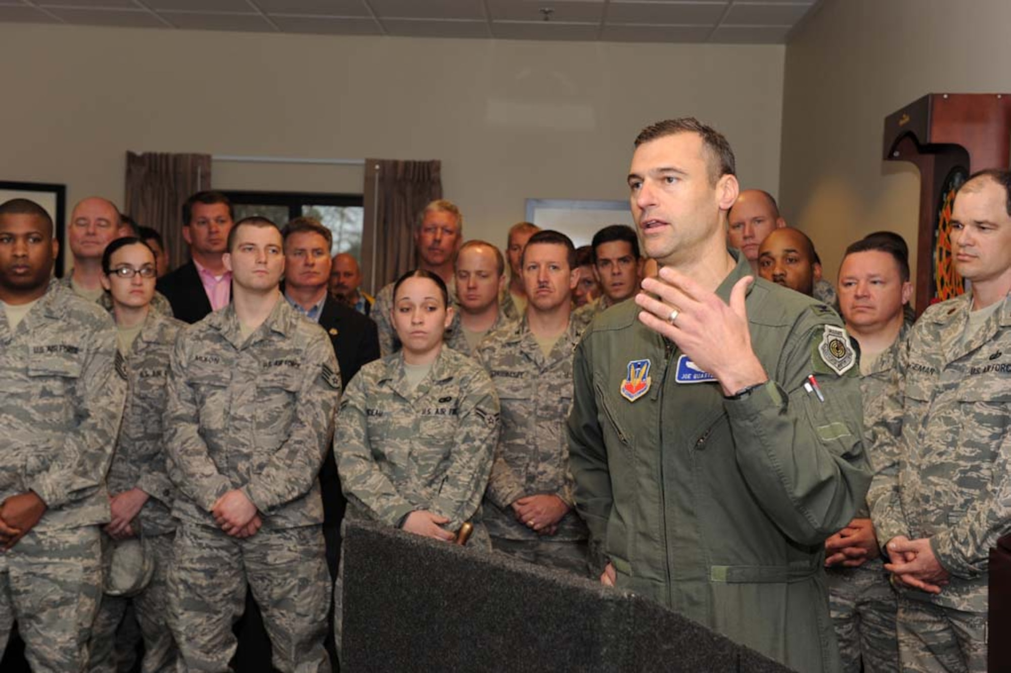 SHAW AIR FORCE BASE, S.C. -- Col. Joseph Guastella, 20th Fighter Wing commander, speaks during the opening of Shaw's new dormitories March 13. The suites in the new dorm consist of a common area with a full kitchen, living room, laundry room and four private bedrooms. Each bedroom is equipped with a private bathroom and a walk-in closet. The new dormitory has space for 144 occupants. (U.S. Air Force photo/Senior Airman Matthew Davis)