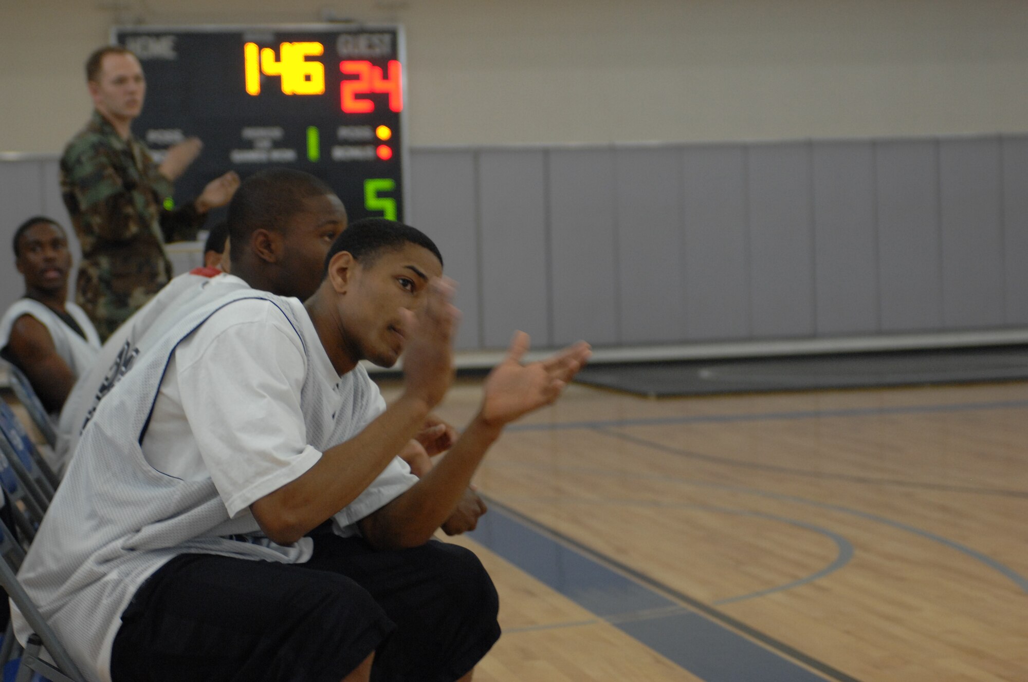 DYESS AIR FORCE BASE, Texas - Members on the 7th CMS bench watch as their team scores in the 1st game of the championship. (U.S. Air Force photo by Staff Sgt. Joel Mease)