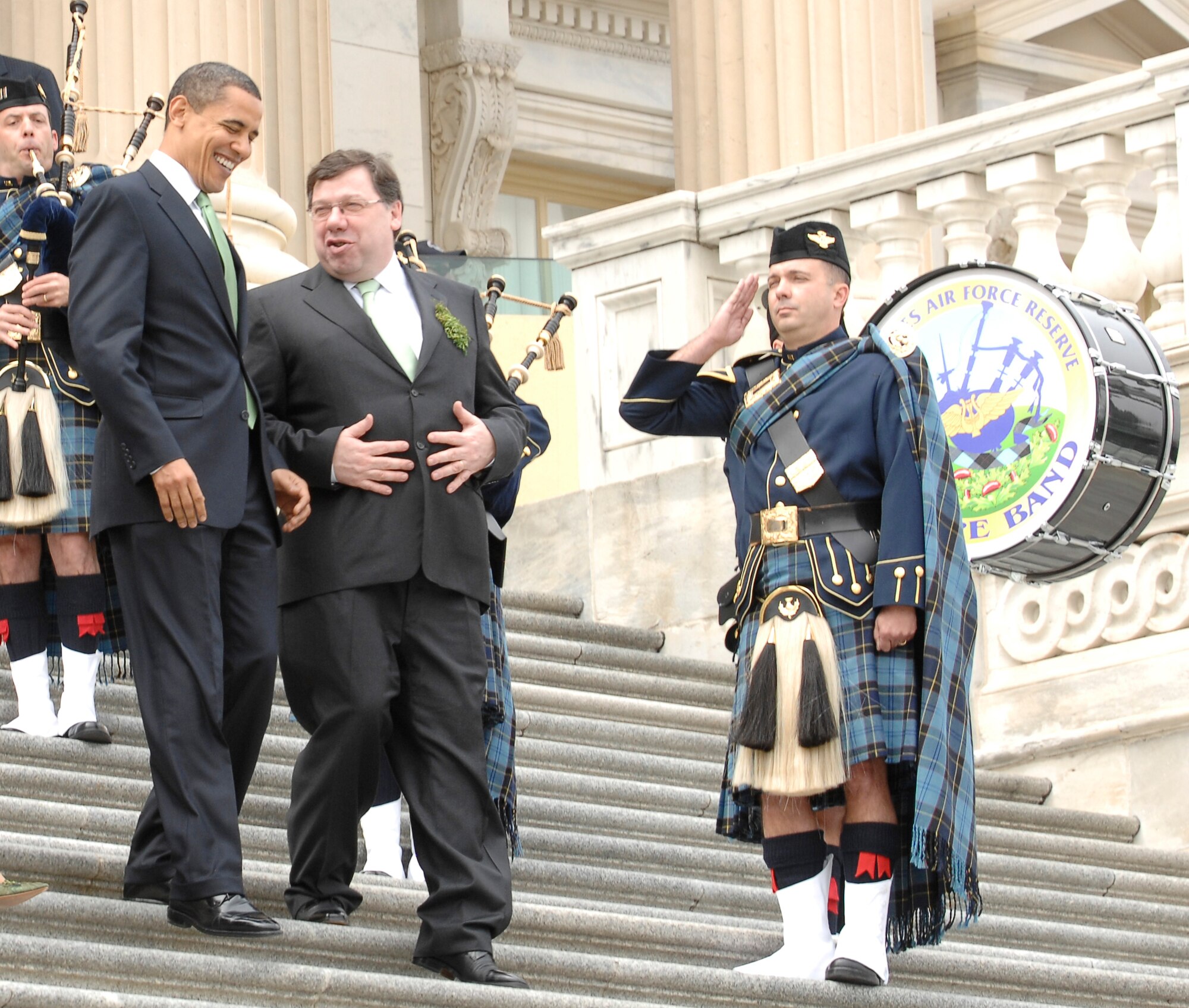 President Barack Obama and Irish Prime Minister Brian Cowen converse as they descend from the U.S. Capital March 17, 2009, to the sounds of traditional Irish tunes performed by the U.S. Air Force Reserve Pipe Band. The pipe band has performed for the president and Irish prime minister at this St. Patrick's Day venue since the 1990s. (U.S. Air Force photo/Andy Morataya)