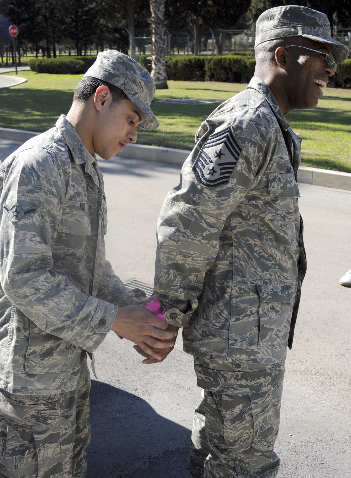 Airman Julian Ruiz, 39th Security Forces Squadron, arrests 39th Air Base Wing command chief Robert Ellis during the Air Force Assistance Fund Telethon March 17 at Incirlik Air Base, Turkey.  American Forces Network Incirlik hosted the telethon and helped raise more than $5,000 in proceeds to be donated to the AFAF.  Donations were made by song requests and a “Jail’n’Bail,” where participants were thrown in “jail” by other individuals. (U.S. Air Force photo/Airman 1st Class Amber Russell)