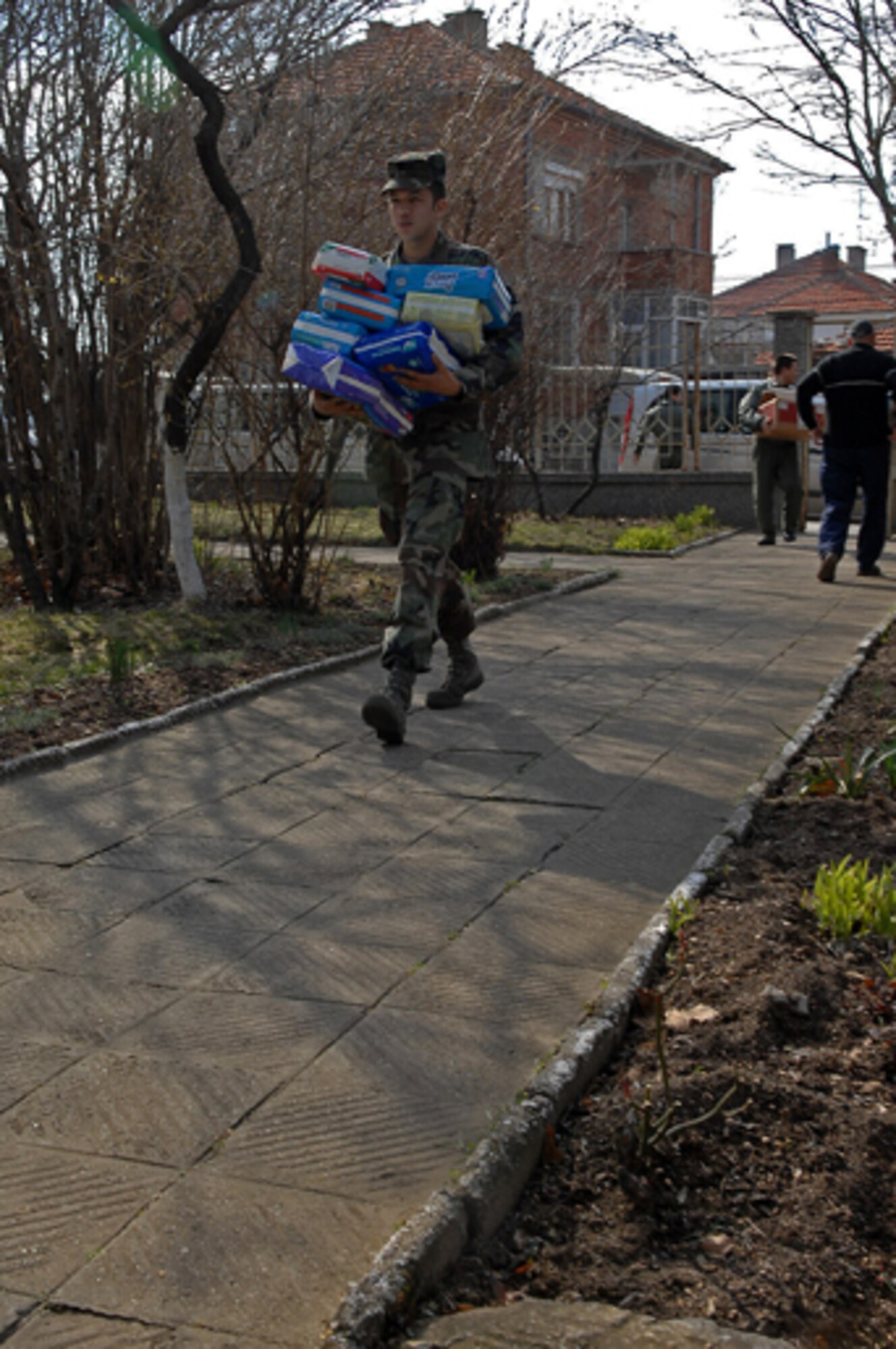 Senior Airman Glenn Maloney, 86th Air Mobility Squadron air transportation journeyman, delivers an arm-full of baby diapers to a Bulgarian orphanage in Sliven, Bulgaria. The diapers were part of a 1,500-pound donation that U.S. forces donated to the Bulgarian orphanage in coordination with a visit there during Operation Thracian Spring, Bezmer Air Base, Bulgaria, March 12, 2009. This exercise is conducted annually since 2007, Operation Thracian Spring is a two week exercise allowing U.S. forces an opportunity to train and interact with their Bulgarian counterparts. (U.S. Air Force photo by Airman 1st Class Tony R. Ritter) 