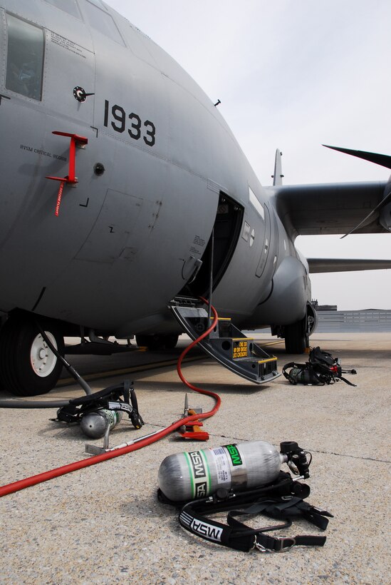 With the aircraft deemed safe, breathing apparatuses and other fire fighting equipment lie on the ground during a training exercise at the 193rd Special Operations Wing of the Pa. Air National Guard located at the Harrisburg International Airport Middletown, Pa. on March 14, 2009.