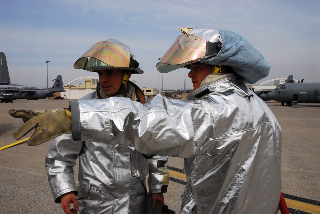 Training never ends.  Here Senior Airman Kevin Heisey (right) of the 193rd Special Operations Wing Pa. Air National Guard's Fire Crash Station points out where to start packing equipment back into the fire truck as Staff Sgt. Gary Edwards listens after a training exercise at the Harrisburg Intenational Airport Middletown, Pa. March 14, 2009.