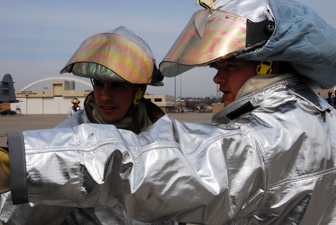 Training never ends.  Here Senior Airman Kevin Heisey (right) of the 193rd Special Operations Wing Pa. Air National Guard's Fire Crash Station points out where to start packing equipment back into the fire truck as Staff Sgt. Gary Edwards listens after a training exercise at the Harrisburg Intenational Airport Middletown, Pa. March 14, 2009.