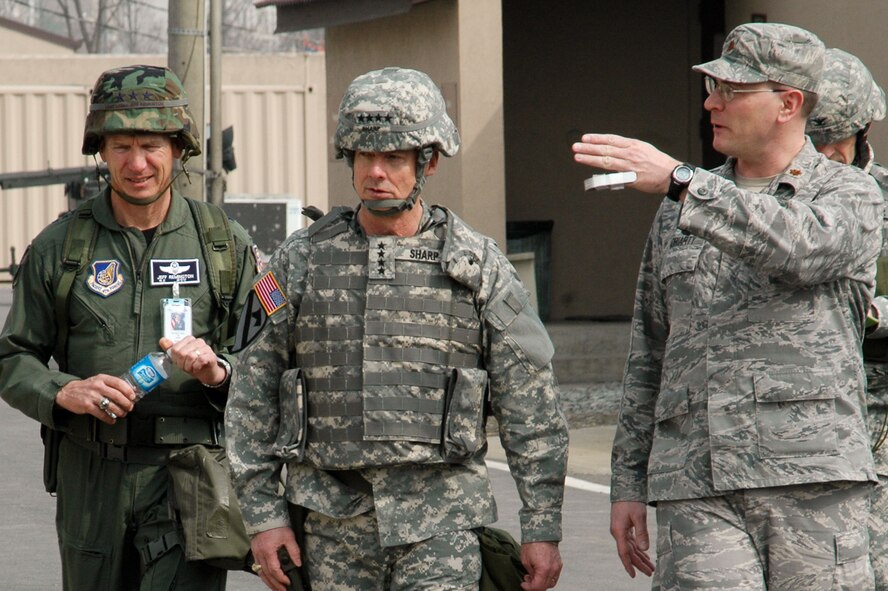 OSAN AIR BASE, Republic of Korea --  Maj. Lynn Moriarty, tent city mayor at Rush Park here, shows the complex to Gen. Walter Sharp, U.S. Forces Korea commander, and Lt. Gen. Jeffrey Remington, commander of Air Component Command, here March 16. Rush Park is the tent city at Osan AB for the peninsula-wide combined exercise Key Resolve/Foal Eagle 09. (U.S. Air Force photo/Staff Sgt. Sam Hymas)