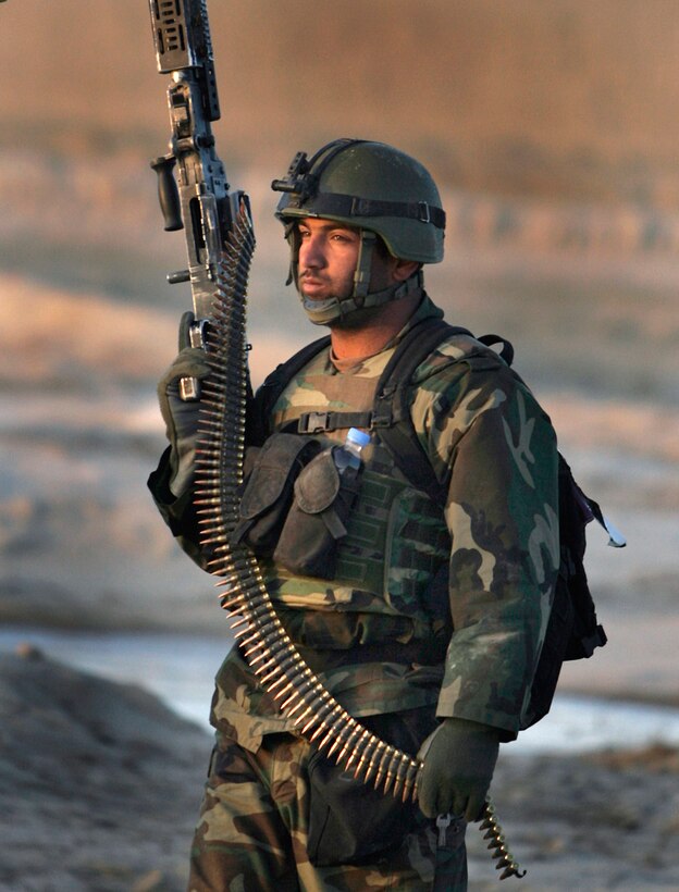 An Afghan National Army Commandos stands down to return to base after conducting an early morning air assault mission to capture a suspected insurgent in the Khowst province, Afghanistan, March 10, 2009.