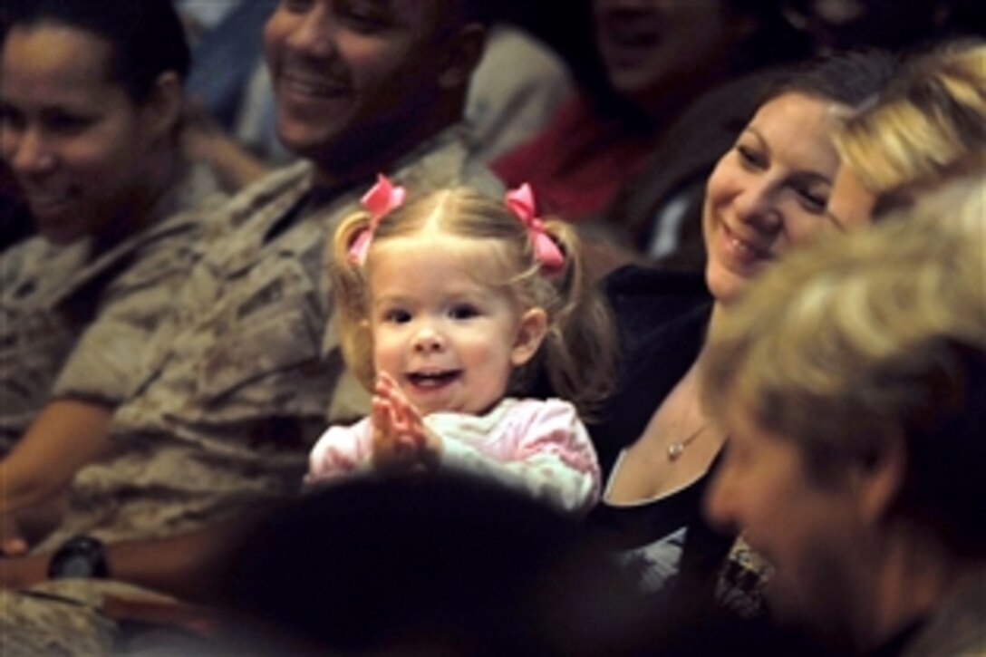 A child laughs at Elmo and Rosita during a screening of a Sesame Street special, "Coming Home: Military Families Cope with Change," at the Pentagon, March 18, 2009. Sesame Workshop, a nonprofit educational organization, has spent two years creating materials to help military families with children cope with deployments, homecomings and changes. 