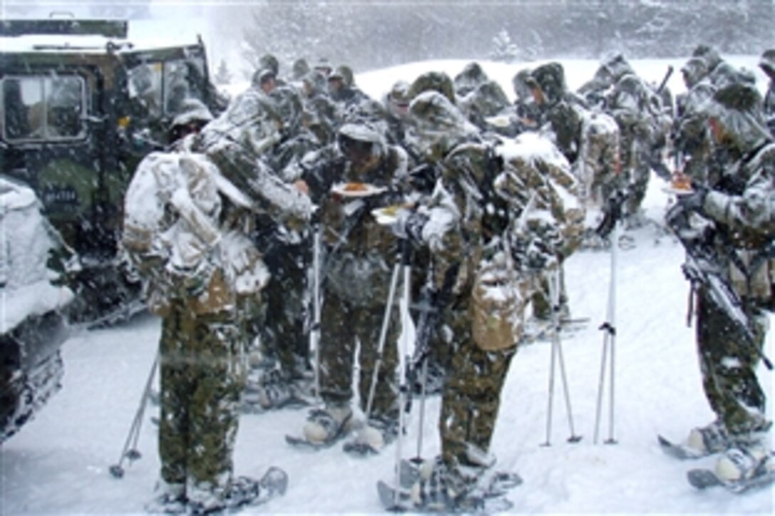 U.S. Marines eat hot chow during a break from mountain warfare training at the Mountain Warfare Training Center in Bridgeport, Calif., March 4, 2009. The Marines are assigned to the 1st Marine Division's 3rd Battalion, 4th Marine Regiment. The battalion executed the 25-day training to prepare for their upcoming deployment later this year. 