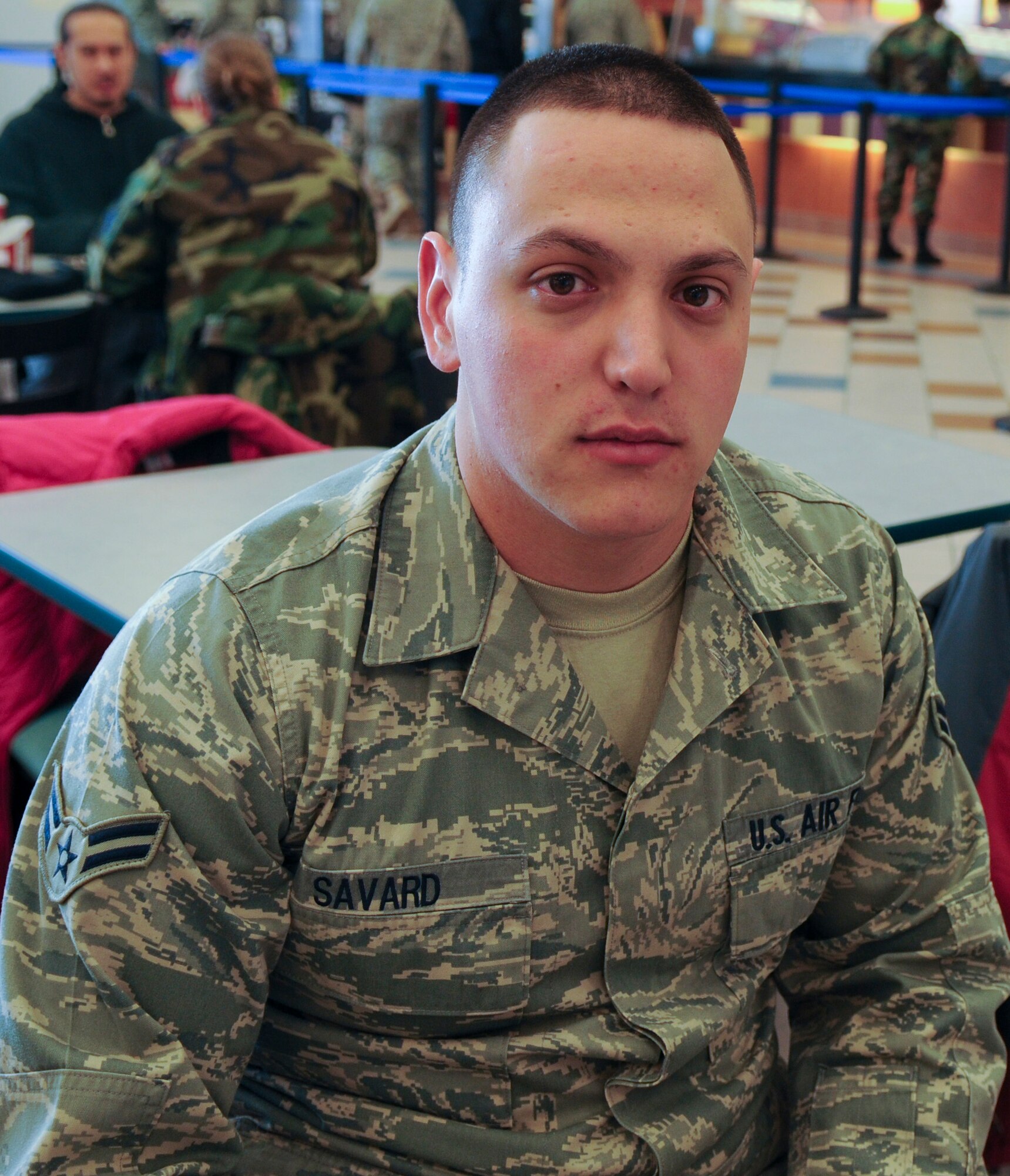 Airman 1st Class Blake Savard, 354th Maintenance Squadron Aerospace Propulsion technician, doesn't agree with President Obama's picks. "I am for the Yukon Huskies." Airman Savard enjoys having friends watch the game at home with him and serves a variety of snacks and drinks. (U.S. Air Force photo/Airman 1st Class Laura Max)
