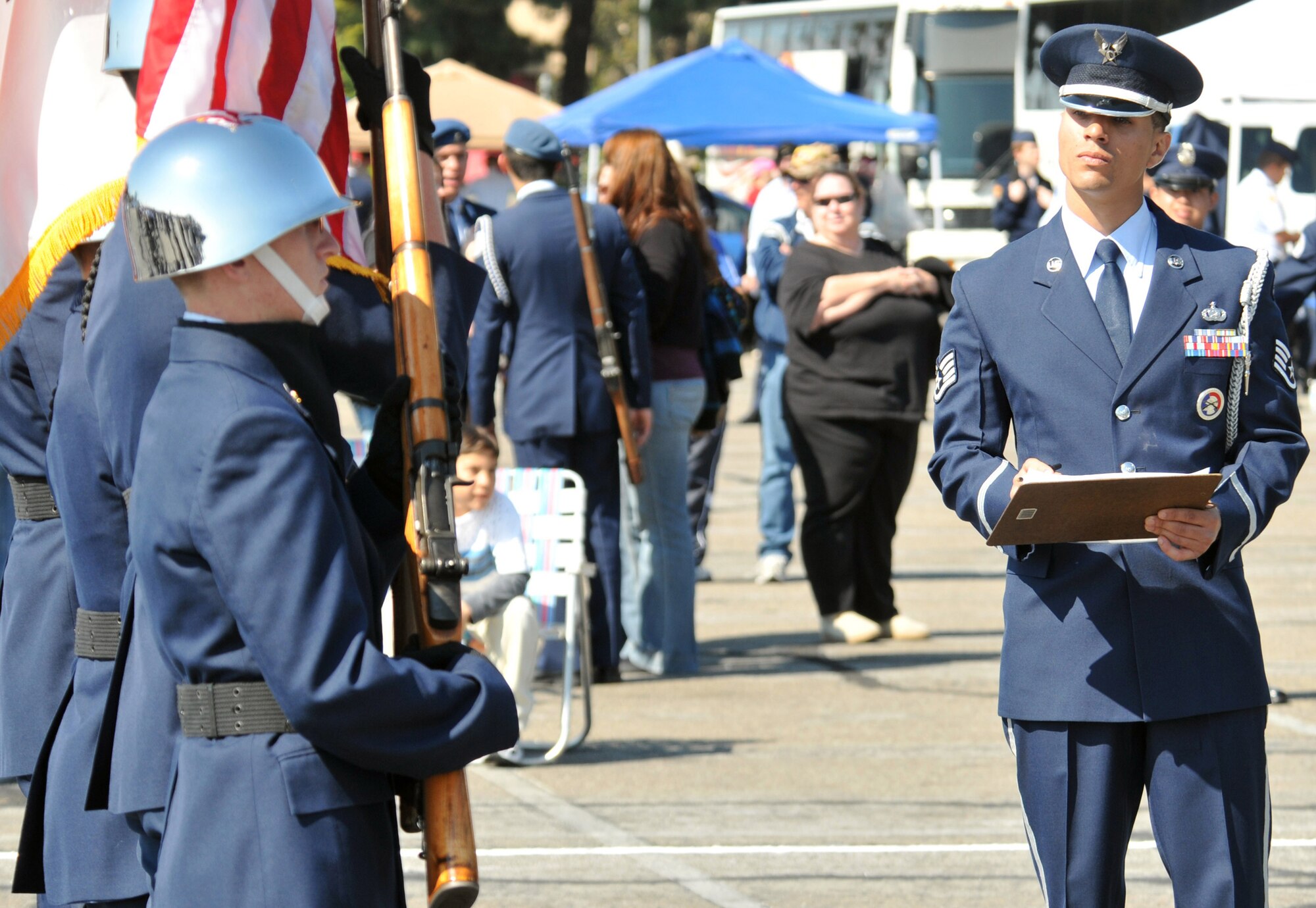 Los Angeles AFB Honor Guard member Staff Sgt. Andre Stevens inspects a color guard team prior to the beginning of competition at the 2009 Southern California Invitation Drill Competition at Angels Stadium, March 7.  More than 700 JROTC and ROTC students competed in this year’s competition.  Infrared Satellite Systems Wing Commander Col. Roger Teague spoke at the ceremony that kicked off the day’s events.  (Photo by Atiba S. Copeland)