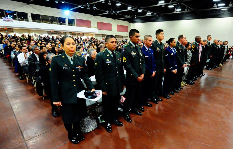 Member of the United States Armed Forces are honored during the Naturalization Ceremony at the El Paso Convention Center March 11. Twenty-one active duty members were among over 1,000 applicants who were awarded their citizenship during the ceremony. (U.S.Air Force Photo/TSgt Chris Flahvie)