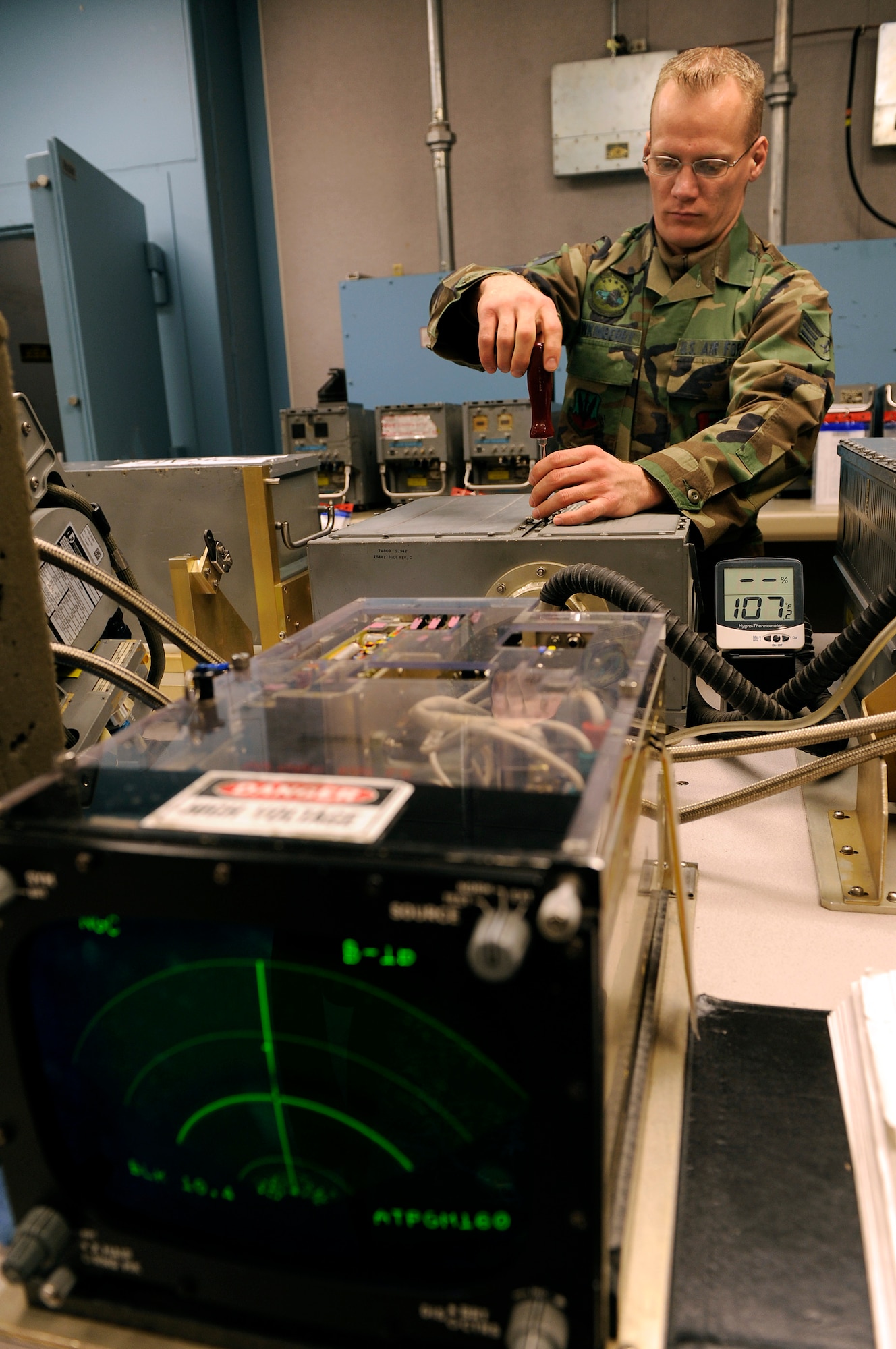 Senior Airman Jason Hawkinberry, 28th Maintenance Squadron avionics test systems journeyman, installs a cover plate to a radio and video signal processor at the 28th Maintenance Squadron, March 18. Members of the 28 MXS provide maintenance support for the 28th Bomb Wing. (U.S. Air Force photo/Senior Airman Marc I. Lane)