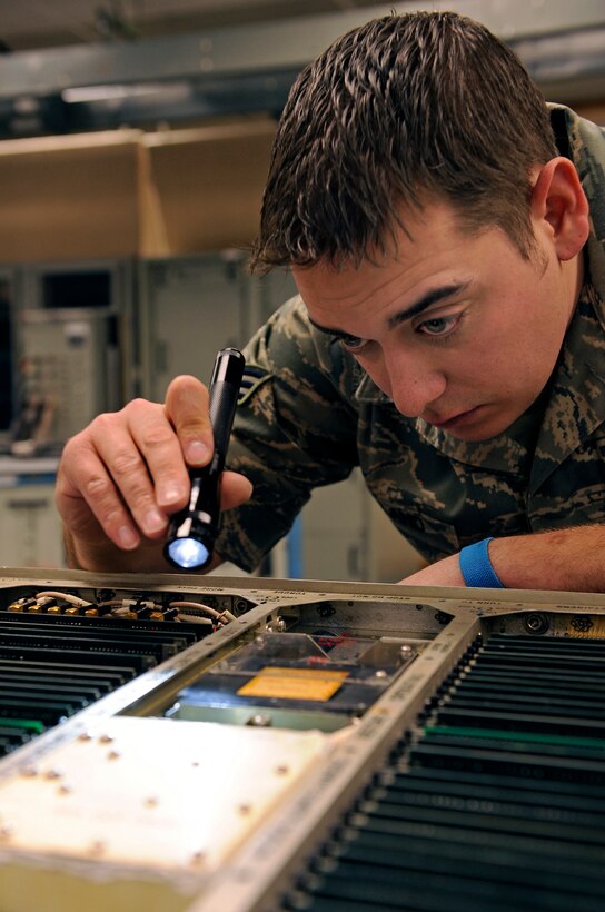 Senior Airman David Holland, 28th Maintenance Squadron avionics test systems journeyman, inspects a control interface unit for foreign objects, broken wires and coolant leaks here, March 18. Members of the 28 MXS provide intermediate-level maintenance for B-1B Lancer aircraft and F-101-GE-102 engines in the 28th Bomb Wing. (U.S. Air Force photo/Senior Airman Marc I. Lane)