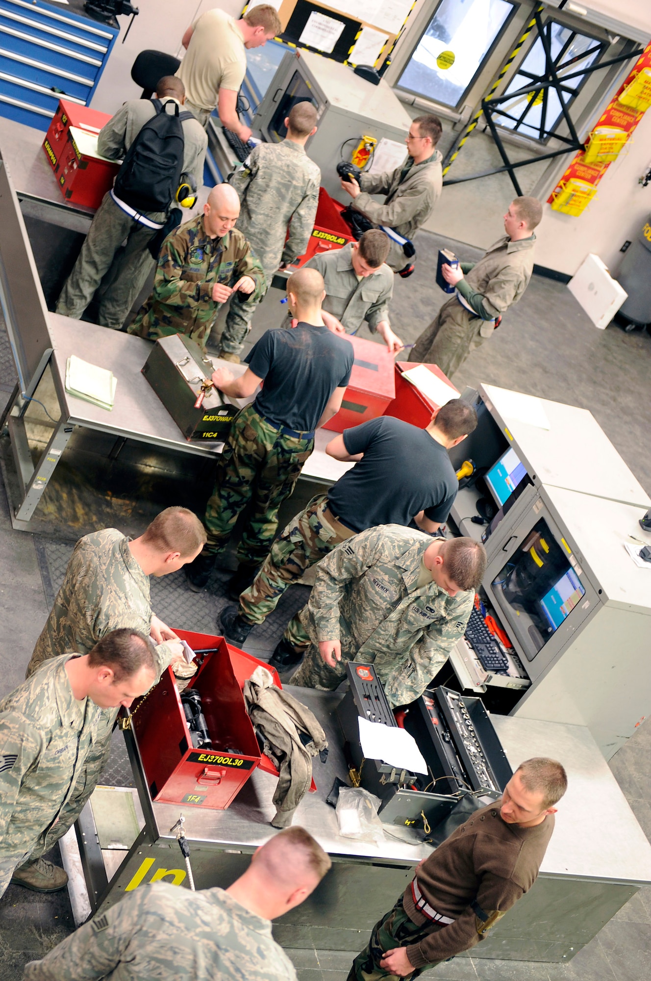 Members of the 28th Aircraft Maintenance Squadron turn in and checkout tool kits during a shift change at the composite tool kit facility, March 16. The 28 AMXS provides on-equipment maintenance to ensure the combat readiness of B-1B Lancers. (U.S. Air Force photo/Senior Airman Marc I. Lane)
